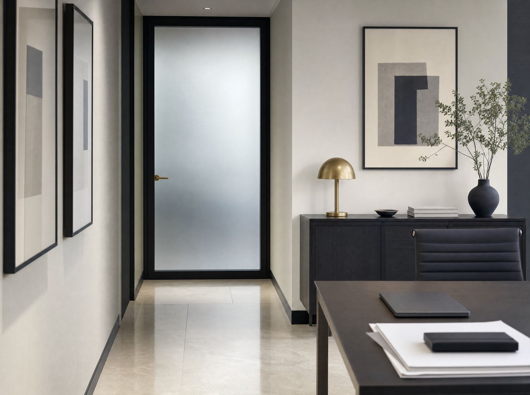 A closed frosted glass meeting room door in a quiet corridor